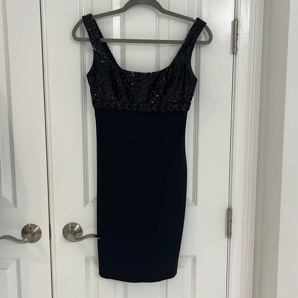Black marchesa dress with beading on the top and fitted throughout.
